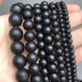 Matte black agate beads for DIY jewelry making in various sizes held by hand - 4mm (Approx 90pcs) / Matte Onyx
