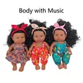 Three African baby dolls in floral outfits with matching headbands and built-in music - 27CM Girl Doll Set of 3