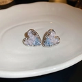 Macro shot of silver heart-shaped stud earrings with blue marble texture on white plate - Silver Blue Heart Stud Earrings (33#)