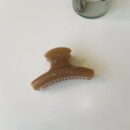 Detail view of a glossy brown resin shark hair claw clip on a plain white background - Medium-8cm / Deep Nude Pink