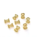 Perline distanziatrici traforate placcate oro 14K per creazione gioielli fai-da-te su bianco - 4*5mm / Oro 14K