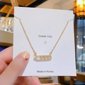 Collier minimaliste en titane doré avec pendentif rectangulaire coulissant en zircon - Collier Zirconium Plein Géométrique Doré