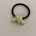 Elastic hair tie with a gold hammered cross metal charm and a black high-stretch band - Knot Bow Wrinkle Gold