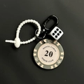 Creative poker chip keychain with grey Monte Carlo 20 chip and white dice on black backdrop - Black White Chip 20 With White Dice Keychain (CS001-20)