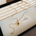 Detail of golden flower necklace with tiger eye stone on beige velvet jewelry box - 51# Gold Flower Pendant Snake Chain