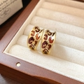 Close-up of vintage leopard print C-shape earrings with gold finish in a velvet box - Wide Leopard Print C-Shaped Hoop Earring (Style 23, Gold)