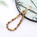 Detail of natural stone phone strap with landscape jasper beads and golden clasp - K3418 Picture Stone Natural Stone Pendant