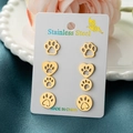 Golden stainless steel cat paw and heart stud earrings set on a decorative card - Gold