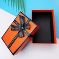 Elegant orange gift box with black ribbon bow and gold Happy lettering for jewelry - Black Bow Gift Box / Orange
