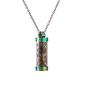 Macro shot of refillable perfume bottle pendant with brown stones and rainbow plating - Tiger Eye Crushed Stones