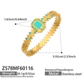 Detail of vintage gold stainless steel cuff featuring green turquoise inlay and wavy edges - Gold Rectangular Turquoise Zigzag Bangle (Z578)
