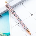 Pink ballpoint pen with blue floral patterns and rose gold trim on a desk - Style D Small Flower Pink