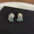 Silver Saturn stud earrings featuring blue cat eye stones and white crystal accents - A14 Silver Saturn Clip Earrings