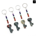 Set of four chakra stone keychains with key-shaped bloodstone pendants and colored beads - African Blood Stone