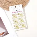 Detail of 6-piece yellow glittery butterfly hair clips on a cartoon cat display card - 6 Pcs Set / Glitter Yellow