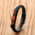 Men's hand-woven black leather bracelet with red agate beads on a natural wood background - Red Brown Agate Striped