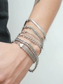 Close-up of stacked 18K silver stainless steel Cuban and snake chain bracelets - Thin Snake Style (B-006) / Steel