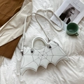 Detail of white PU leather crossbody bag with embroidered bat wings and spider metal charms - One Size / White