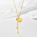 Golden cat's eye coin pouch necklace with tassels on white soft fabric background - Lucky Cat's Eye Fortune Bag Style (851)