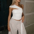 Detail of white one-shoulder slim top with ruched texture and hollow-out design - S / White