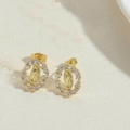 Macro detail of 14K gold plated Virgin Mary stud earrings with sparkling cubic zirconia - Gold - White Large Zircon