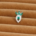 Macro shot of a strawberry shaped earring with green and white zircons on silver base - Strawberry Style (E1357-10)