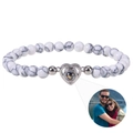 Detail of custom heart projection bracelet with white marble beads and photo pendant - White Howlite Bracelet