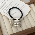 Minimalist punk style ponytail holder with silver hollow metal cage buckle and black elastic - GD431 Silver Rounded Hollow