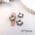 Close-up of heart-shaped crown nail art charms with silver alloy and crystal rhinestones - Silver-White