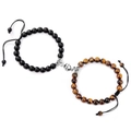 Macro shot of magnetic heart clasp connecting matte black and tiger eye bead bracelets - Matte Stone + Tiger Eye