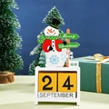 Christmas snowman wooden advent calendar with blocks on festive table background - Snowman Calendar