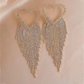 Detailed close-up of golden heart-shaped fringe earrings with rhinestones on silk fabric - Heart Tassel (925 Sterling Silver Earring Post) / Gold