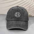 Unisex washed denim baseball cap with a white embroidered winking smiley face - One Size / Black