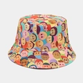 Vista dettagliata del cappello da pescatore graffiti con motivi di volti a fumetti - M (56-58cm) / Volto di Cartone Animato