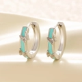 Silver-toned hoop earrings with light green enamel and 3D butterfly charms on beige fabric - Blue-Green Enamel Butterfly Ear Buckles (A204)