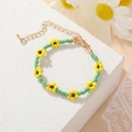 Bohemian seed bead flower bracelet with yellow and green daisies and golden clasp - Green Daisy Bracelet