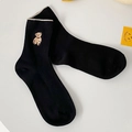Black mid-calf ribbed socks featuring brown bear embroidery and wavy cream-colored cuffs - One Size / Black