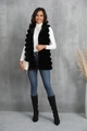 Chic long black faux fur vest paired with white turtleneck and stylish boots - S / Black