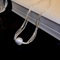 Dettaglio macro della catena a serpente argento multistrato con perla opaca - Collana Multistrato in Argento