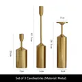 Three-piece gold metal candle holder set with brushed finish in various heights - Candlestick Three-piece Set