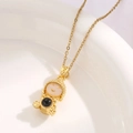 Macro shot of bear pendant necklace showing golden metal craft and resin details - Golden Cartoon Lucky Star