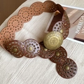 Detailed close-up of a caramel brown leather belt with brass floral embossed buckle - 2# Waist Chain - Light Coffee