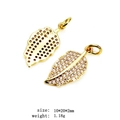 Detailed close-up of gold-plated leaf pendants with micro-paved zircons for DIY jewelry - 9-Leaf
