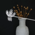 Detailed close-up of a silver phoenix hair pin with hollow feather fringe and tassels - Spreading Phoenix Hollow Feather Tassel (F466-9)