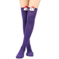 Detail of purple knitted over-the-knee socks with a 3D plush Santa Claus at the top - One Size / Pure Purple