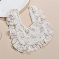 Detail of 4-layer cotton muslin baby bib with purple floral print and ruffle edges - Little Purple Flower