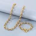 Set collana e bracciale a catena spessa dorata con chiusura a T su sfondo grigio - Collana 50cm / Stile A Oro