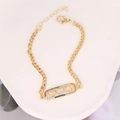 Detail of gold bracelet featuring rainbow zircon hearts on a hollow rectangular charm - Triple Heart Rainbow Zircon Tag (17#)