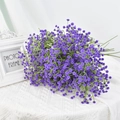 Single bundle of purple artificial gypsophila flowers with green stems on white fabric - Deep purple