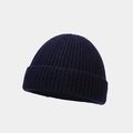 Close-up of deep navy blue knit texture and fine craftsmanship on the skull cap - One Size / Dark Blue